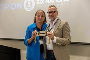 Rebecca Jamieson, Six Nations Polytechnic President - CEO, presented Alfonso Licata, ORION President - CEO, with a wampum belt symbolizing friendship and respect in closing remarks of new partnership’s launch event (photo: ORION blog)